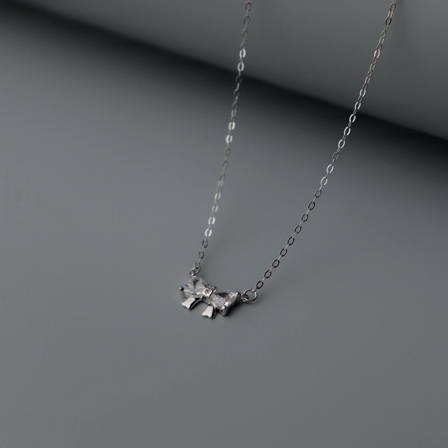 CADE S925 Silver Mini Bow Tie Ribbon Pendant SN00028